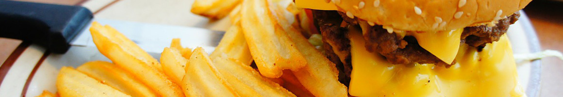 Eating American (Traditional) Burger at Hogan's Bar & Grill restaurant in Goldsboro, PA.